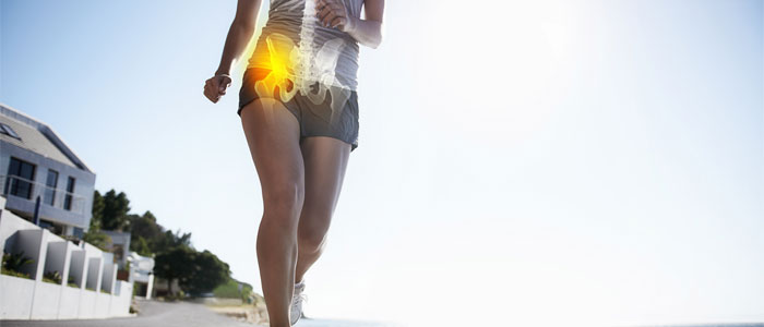 a girl running with hip pain